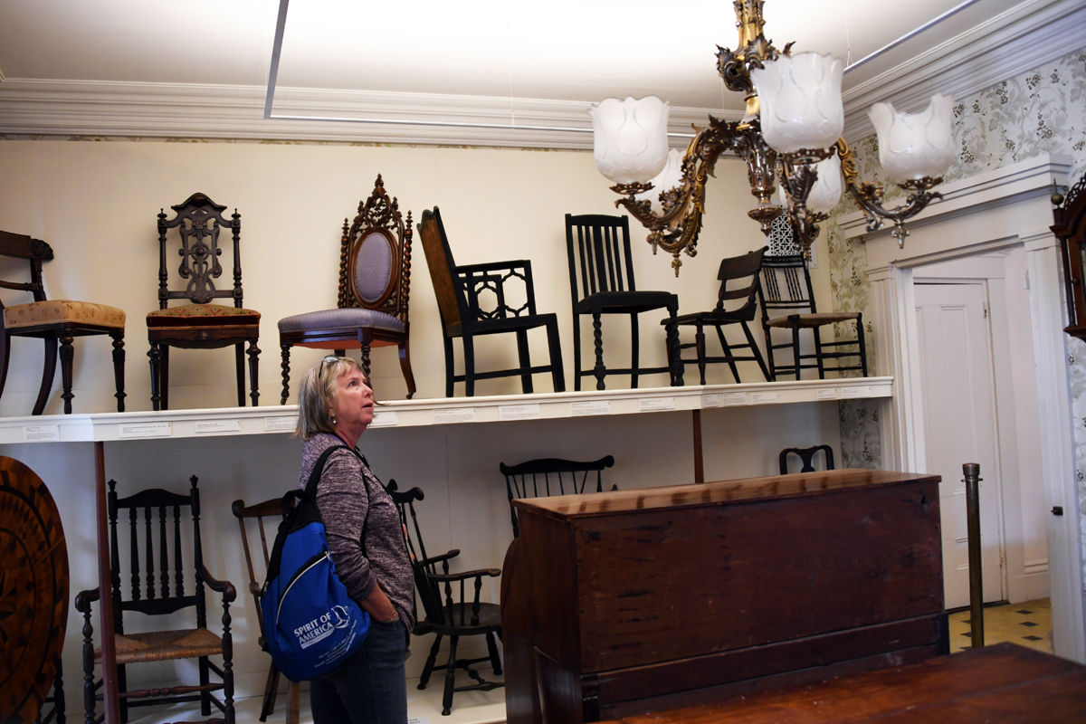 111 Joan Gocke admires the furniture display at the Hadwen House.jpg